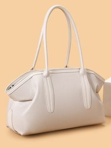 Minimalist beige pebble leather tote bag for women featuring long shoulder straps