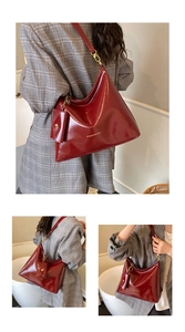 Detail of wine red tote bag with glossy finish and matching coin purse attachment