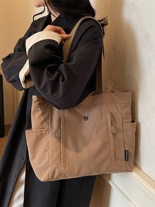 Waterproof nylon tote bag in coffee brown with wide straps for casual commute usage