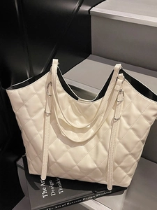 Chic beige quilted tote bag with dual shoulder straps and diamond stitching pattern