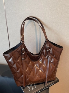 Brown large capacity quilted tote bag with glossy finish and elegant shoulder straps