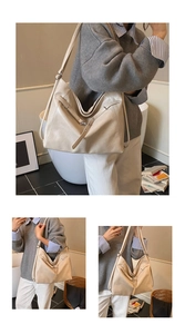 Detail view of large beige leather hobo bag with adjustable buckle strap and soft texture