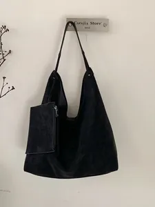 Minimalist black matte large hobo tote bag with matching zippered pouch and vintage style