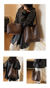 Detail of dark brown faux leather bucket bag set with golden metal clasp and inner pouch