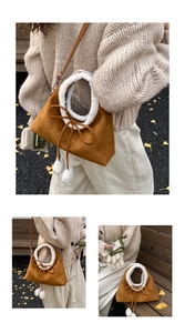 Detail of brown suede crossbody bag with white faux fur trim and cute pompom charms