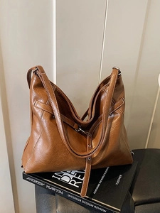 Retro brown leather large capacity tote bag with adjustable shoulder strap and silver hardware