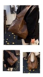 Detail of vintage coffee brown oil wax leather tote bag with metallic plate and side ties