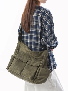 Olive green large canvas shoulder bag with multi-pockets in retro workwear style