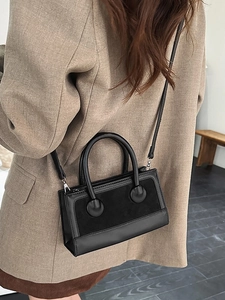 Retro black leather handbag with crossbody strap and stylish contrast texture for daily wear