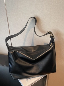 Minimalist black matte leather large tote bag with gold buckle for commuting