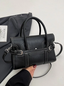 Minimalist black leather crossbody bag with white contrast stitching and top handles