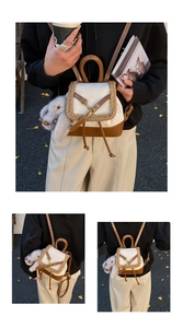 Detail of suede mini backpack with beige faux fur trim and cute rabbit plush charm