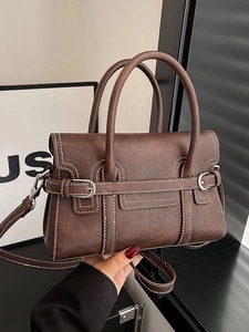 Brown vintage textured leather tote bag with white stitching and silver buckle detail