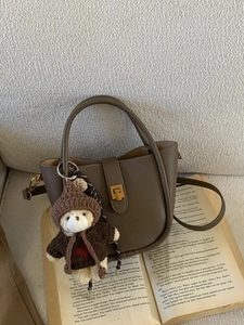 Vintage brown lychee grain leather bucket bag with gold lock and cute bear charm