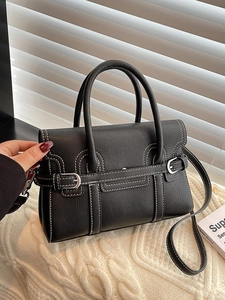 Chic black PU leather handbag with white contrast stitching and silver buckle detail