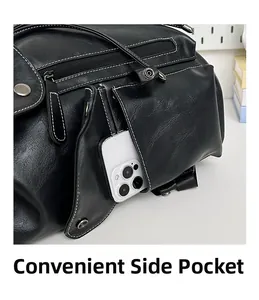 Close-up of black leather backpack side pocket showing texture and stitching details