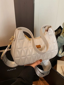 White quilted faux leather shoulder bag with adjustable printed strap and gold hardware