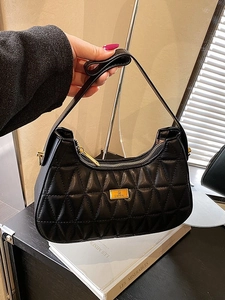 Black quilted hobo shoulder bag with golden hardware and chain strap for women