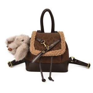 Brown leather and suede mini backpack with plush trim and cute grey rabbit keychain