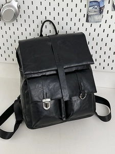 Minimalist black faux leather backpack with silver buckles and large capacity for travel
