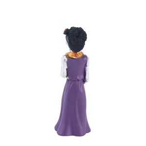 Back view of a Day of the Dead female skeleton figurine wearing a purple resin gown