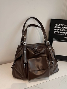Retro oversized brown soft leather tote bag with vintage metal grommet shoulder straps