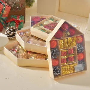 Detailed view of Christmas ornament gift set featuring colorful baubles and pine cones