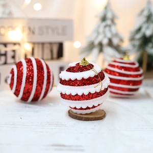 Sparkling red Christmas ball ornament with white plush trim and golden hanging cord