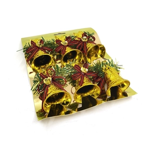 Set of 6 gold Christmas bells with red ribbon bows and pine needles on card