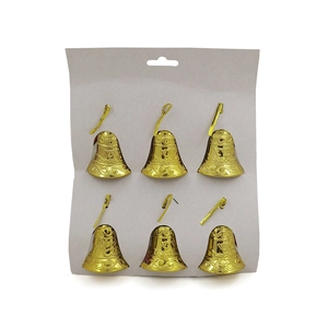 Detail of six gold Merry Christmas bells with engravings on original card packaging