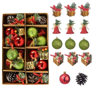 Christmas ornaments set with red green balls, bells, drums and pinecones in a gift box