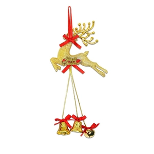 Golden Christmas reindeer ornament with red ribbon bow and bells on a white background