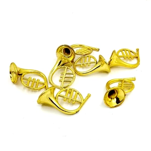 Close-up of golden miniature horn ornaments for Christmas tree wreath decorations
