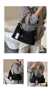 Détail du sac hobo en daim noir avec poignée tressée et étiquette logo élégante