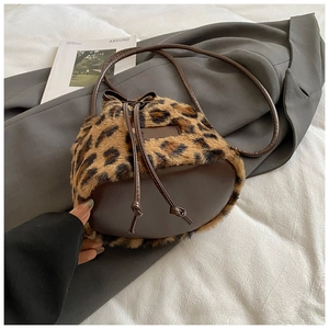 Close-up of leopard print faux fur texture and brown leather drawstring detail