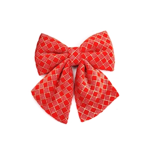 Red Christmas bow with gold glitter mesh pattern for tree decoration and festive ornaments