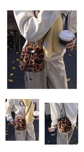 Detail of leopard print plush bucket bag featuring a brown leather bow and drawstring closure