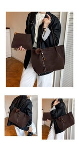 Detail of dark brown suede tote bag with pompom charm and matching clutch set for women