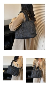 Macro detail of black pleated textured tote bag with puffy jacquard fabric handles