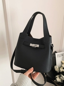 Classic black lychee pattern leather bucket bag with silver turn-lock and shoulder strap
