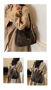 Detail of dark brown faux suede tote bag with cross straps and cute bear pendant
