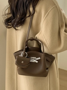Minimalist brown pebbled leather underarm bag with small coin purse and silver buckle