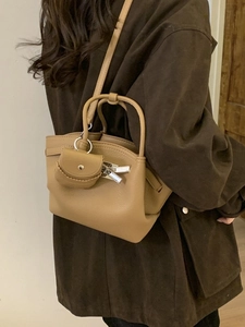 Chic camel faux leather underarm bag with silver hardware and micro charm purse