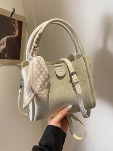 Cream white leather bucket bag with silk scarf handle and silver metal hardware