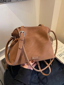 Brown frosted bucket bag for women with drawstring closure and adjustable shoulder strap