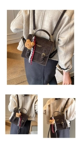 Detail showing vintage brown crossbody bag with contrast stitching and teddy bear charm