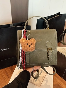 Olive green vintage Korean backpack with double buckle and brown bear charm