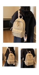 Détail de la poche avant matelassée et des bretelles mode sur un sac à dos beige