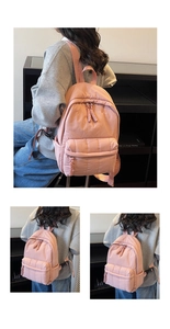 Vue détaillée du sac à dos matelassé rose avec fermetures à glissière doubles