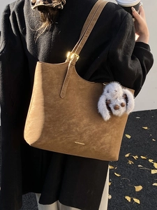 Retro dark brown suede tote bag with adjustable strap and plush rabbit pendant charm